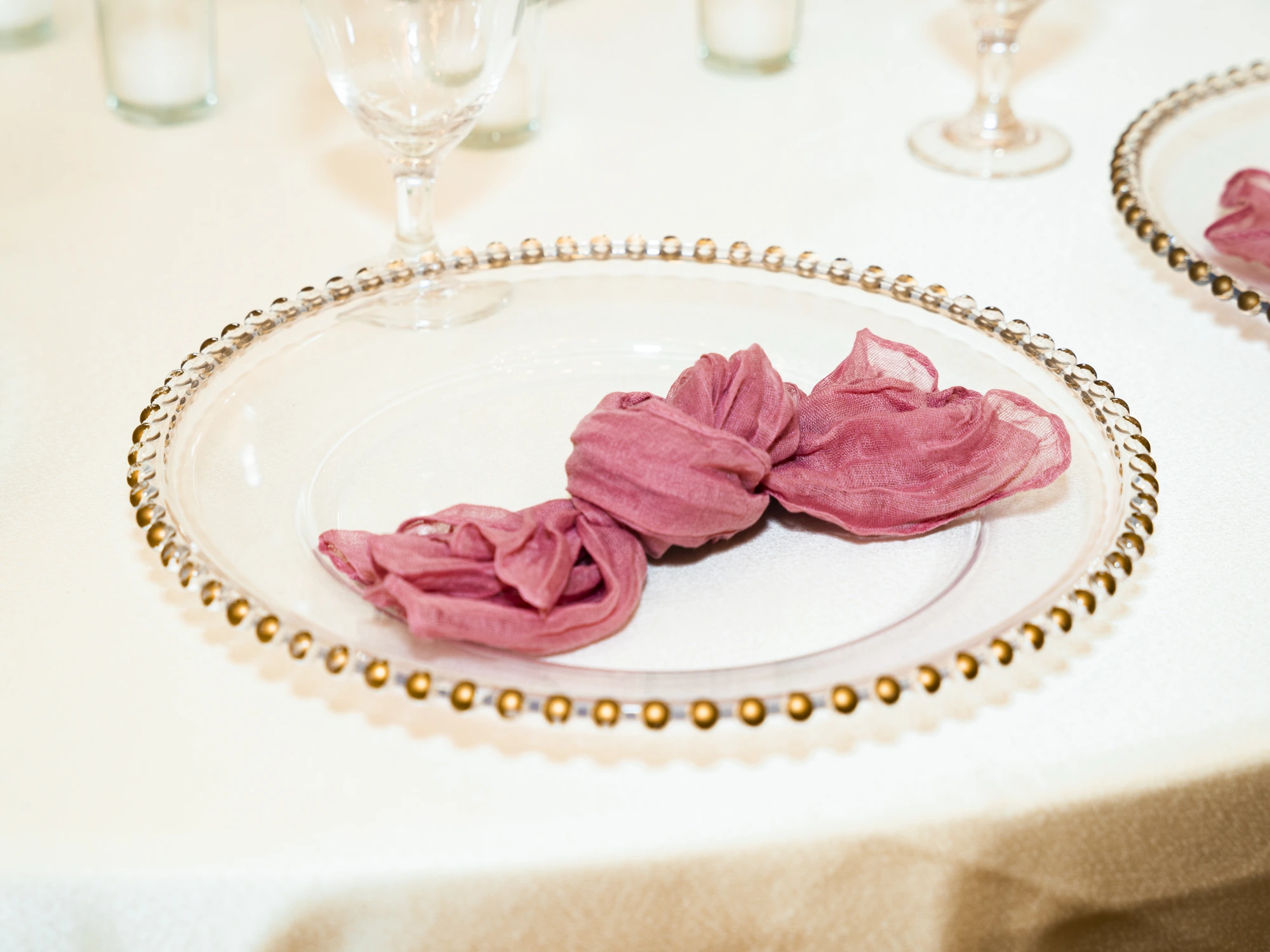 Place setting detail with gold beaded charger