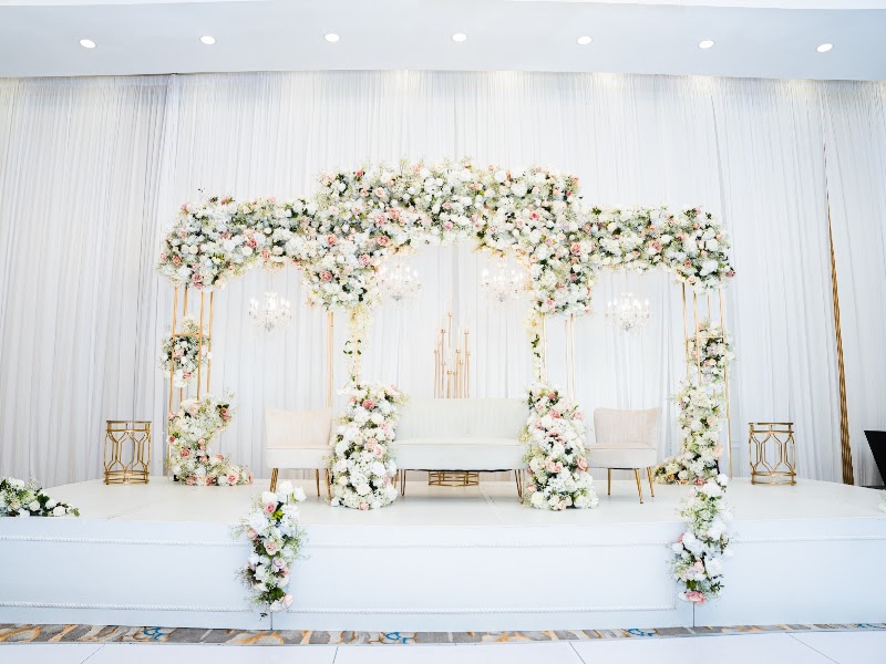 White and green floral stage backdrop