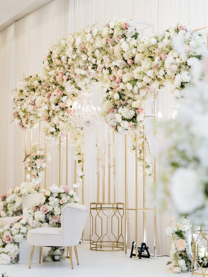 White floral ceremony arch