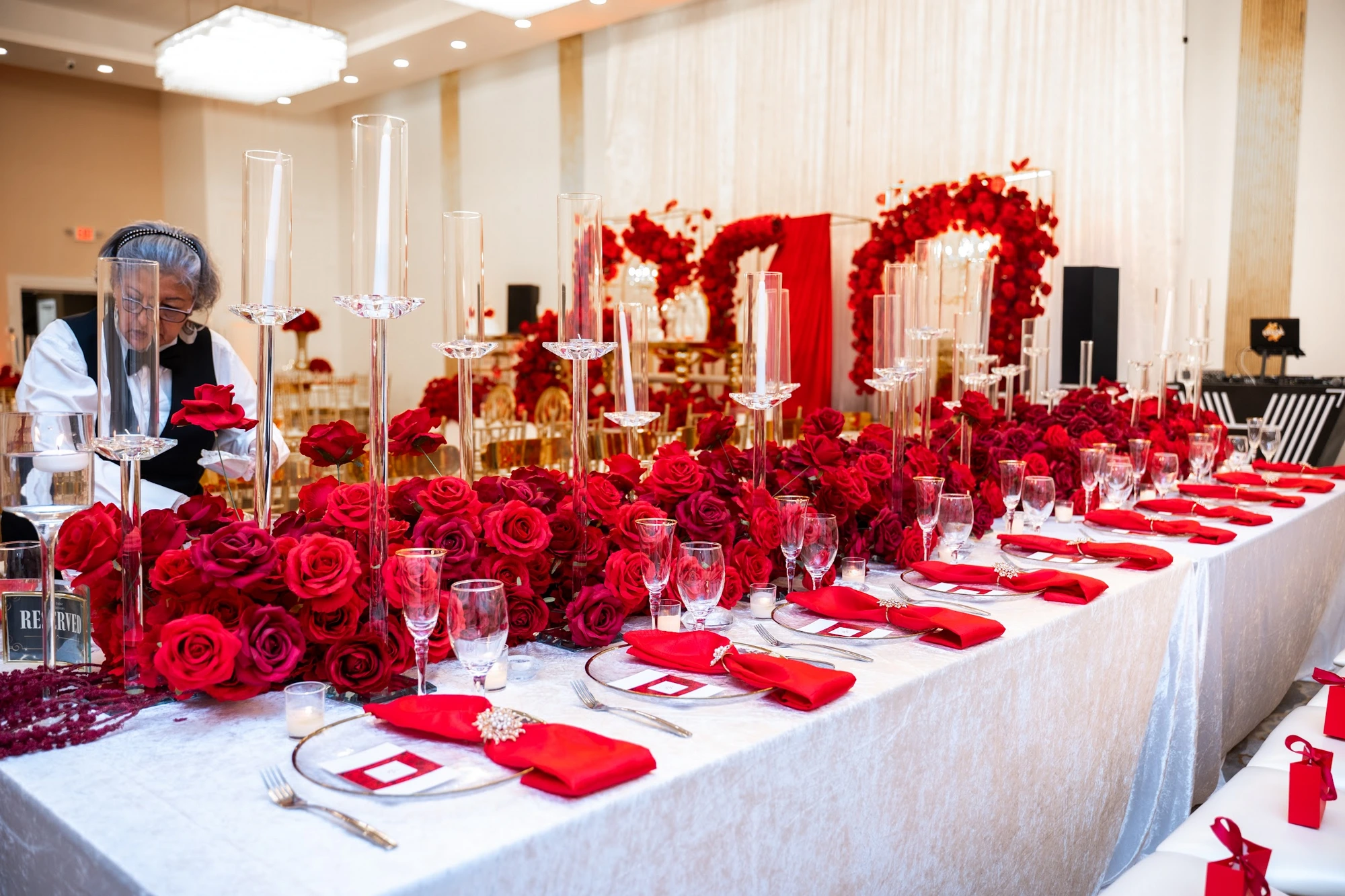 Red napkin place setting with gold charger