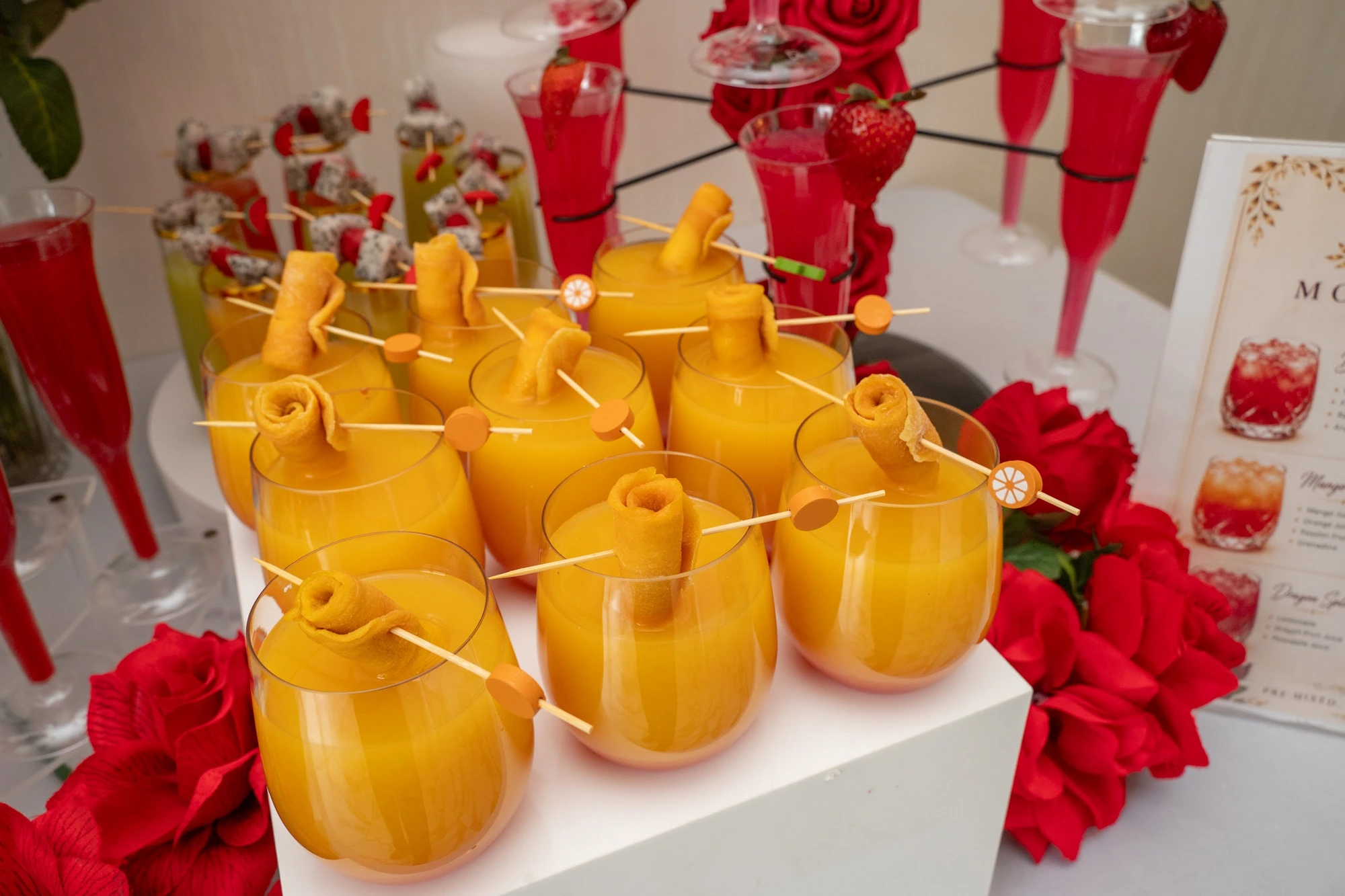 Signature drinks with red rose accents
